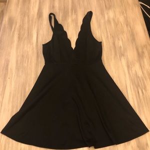 Mini black dress with front and back deep v